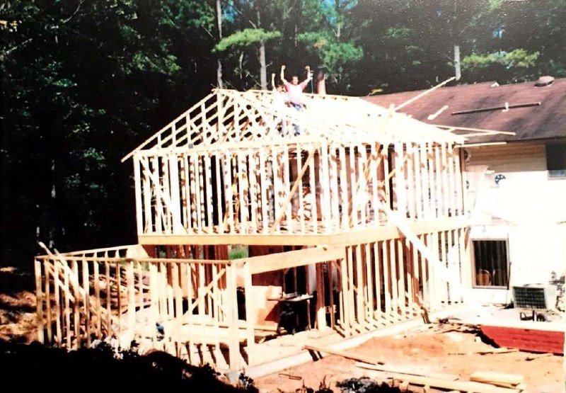 13-year-old Nathan Spearing on the roof of the 1,700 sq ft addition he helped his father build